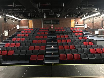 cinema auditorium with black and red seats