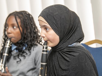 Two students play the clarinet