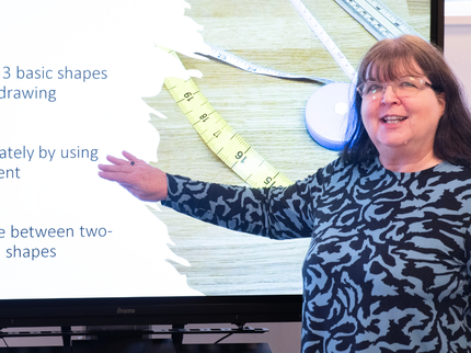 Teaching Staff in front of smart board