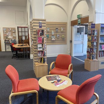 Huthwaite library interior showing seating area and display shelf