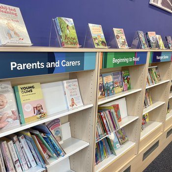 Parents and carers shelving in children's area