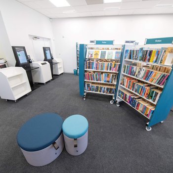 Hucknall Library interior, adult fiction shelves and self-service machines