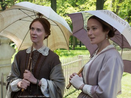 A Quiet Passion.  Two ladies standing with parasols in Victorian dress