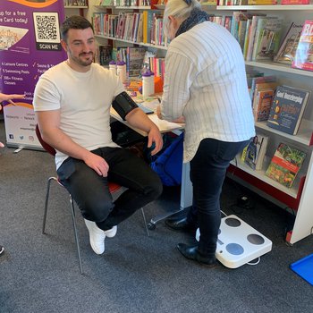 Person getting their blood pressure checked