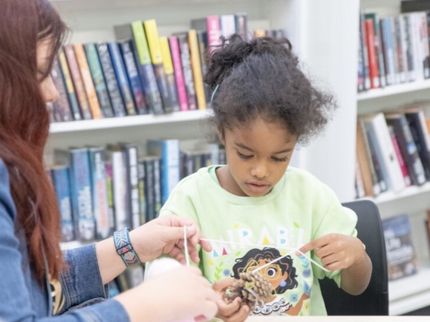 parent child smiling at music event Hucknall library.jpg