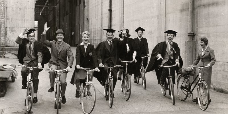 8 people from the Carry on Teacher film on Raleigh bikes