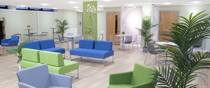 Mansfield cafe area with seating and tables in blue and green.