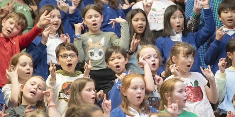 A group of children sing