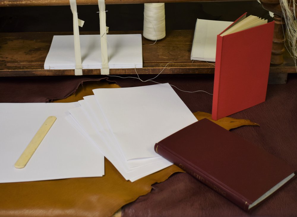 Examples of book binding on a table