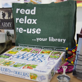 Memory lane bag display with books and other resources on a table