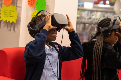 child wearing a VR headset in a library