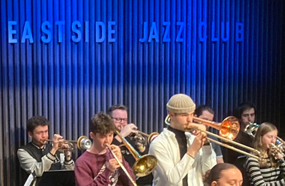 Group photo of members of the Eastside Jazz Quartet performing with other musicians