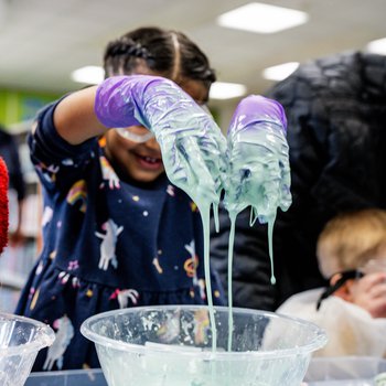 A girl experiments with slime.