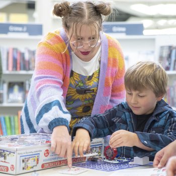 Woman and boy take part in snap circuits activity