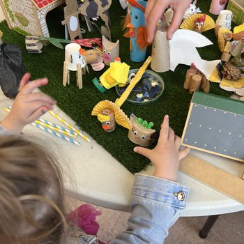 Photo of children building stop-motion animation model scene