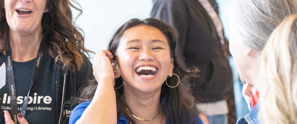 a young woman is reacting to her GCSE results - she is overjoyed