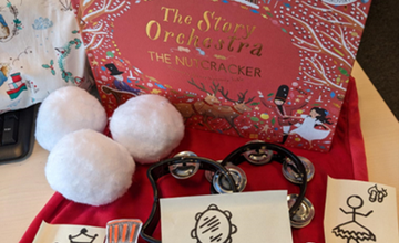 Crafts and book surrounding the Nutcracker