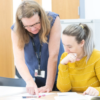 tutor helping a learner