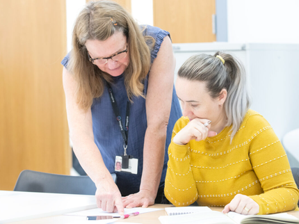 tutor helping a learner