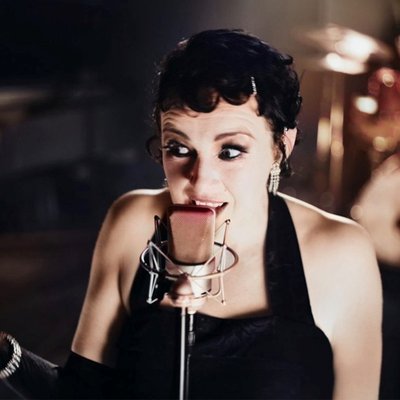 Photo of lady jazz singer with old-fashioned microphone