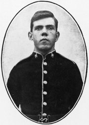 an old black and white photo of a young man in military uniform
