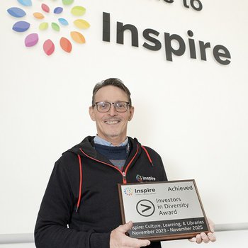 Peter Gaw smiles as Inspire are presented with accreditation for achieving Investors in Diversity.