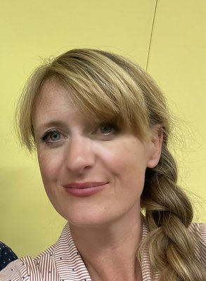 a selfie image of a blonde woman smiling