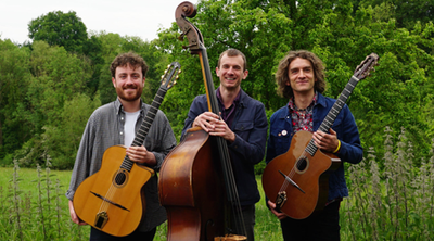 Photograph of the three members of the Hot club Trio with instruments