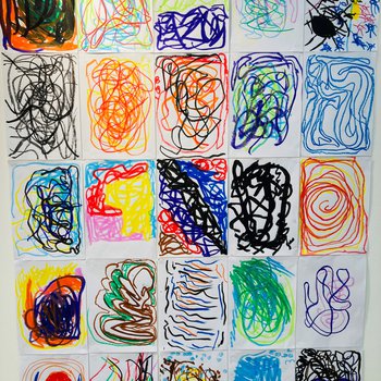 A photograph of A4 colourful mark making artwork on a gallery wall