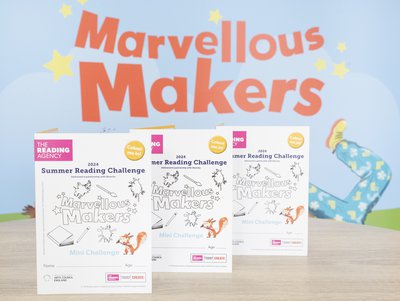 Three Marvellous Makers Mini Challenge folders propped up on a table