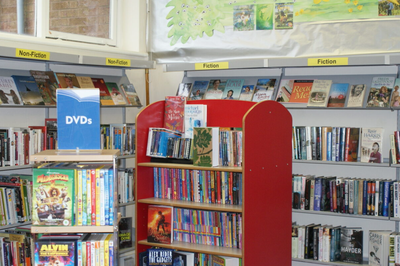 Pre-refurbishment image of Balmoral Library showing old stock with outdated shelving and decoration