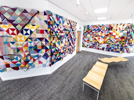 Wall of care squares blankets at Mansfield Central Library