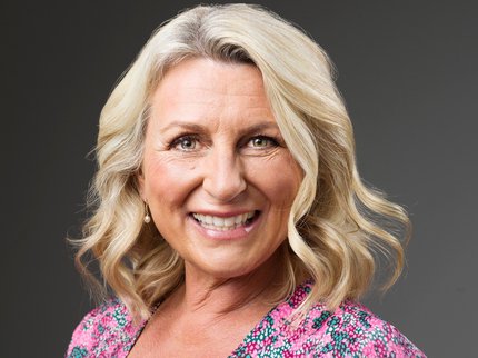 Photo of author Cathy Bramley - a white woman with long blonde hair, wearing a floral top.