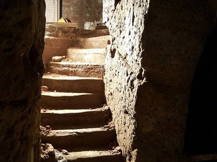 A colour photograph of a carved staircase inside a cave