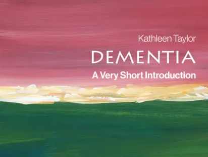 Green and pink front cover of a book called Introduction to Dementia