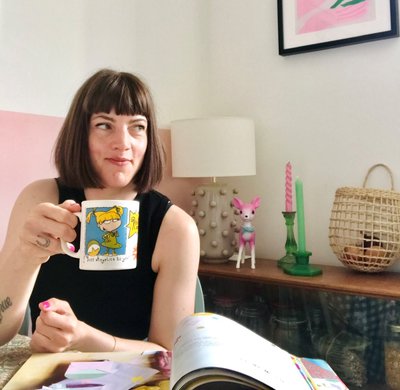 Photo of children's author Elissa Elwick - a white woman with brown hair holding a mug.