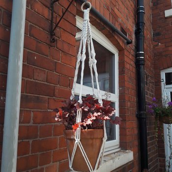 Macramé plant hanger with flowers