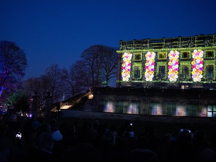 Colourful flowers projected on to Nottingham Castle