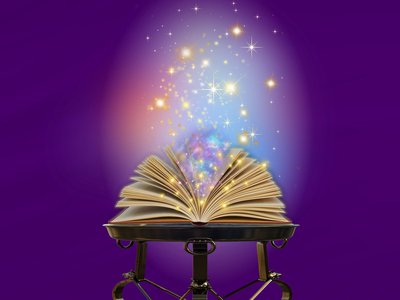 Book on a purple background with sparkles coming out of it