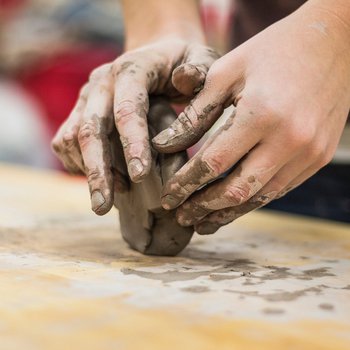 Hands modelling clay