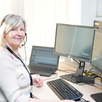 member of staff wearing a headset