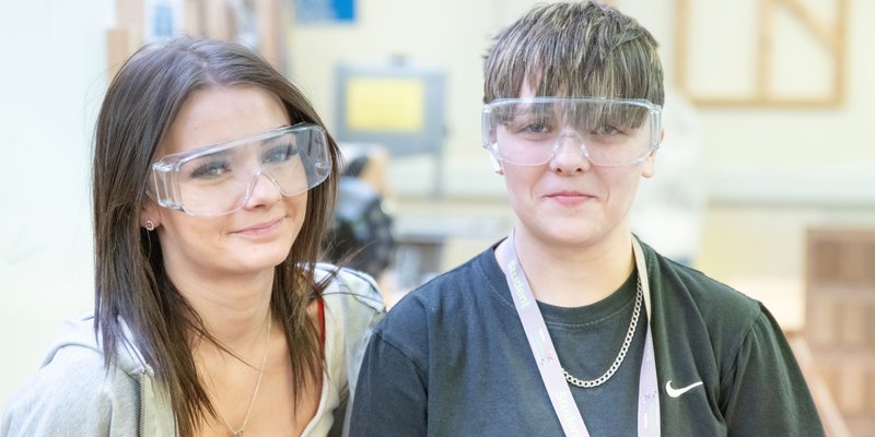 Two Inspire College learners in safety goggles.